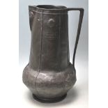 A early 20th century Art Nouveau pewter jug with t