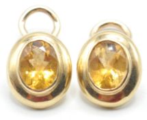 PAIR OF LADIES 9CT GOLD AND ORANGE STONE CLIP ON E