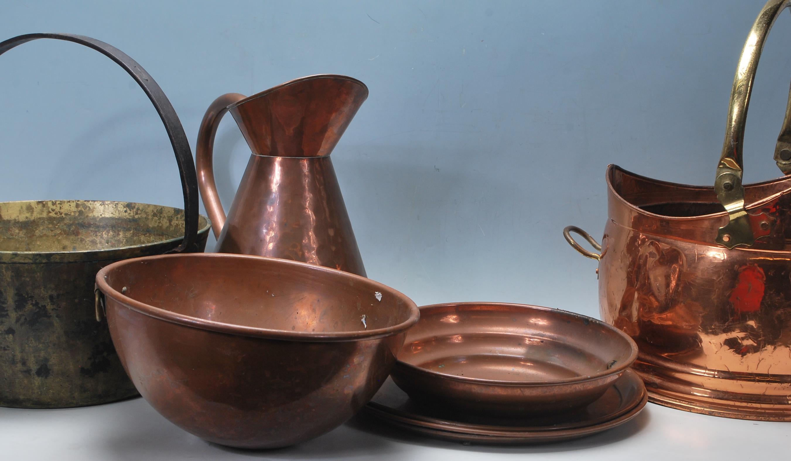 A quantity of early 20th century copper vessels an