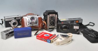 A collection of vintage 20th century cameras to in