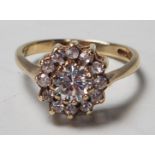 A hallmarked 9ct gold white stone cluster ring bei