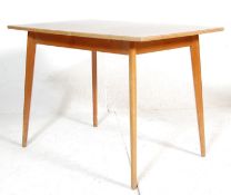 MID CENTURY TEAK AND FORMICA TOPPED DINING TABLE