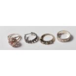 COLLECTION OF 4 SILVER DRESS - BAND RINGS