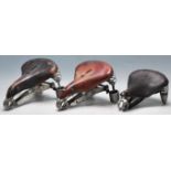 COLLECTION OF THREE ANTIQUE LEATHER SADDLES