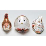 A COLLECTION OF THREE ROYAL CROWN DERBY CERAMIC PAPERWEIGHTS