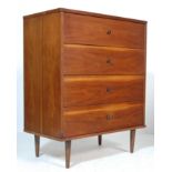 A VINTAGE 1970’S DANISH INSPIRED CHEST OF DRAWERS RAISED ON TURNED LEGS