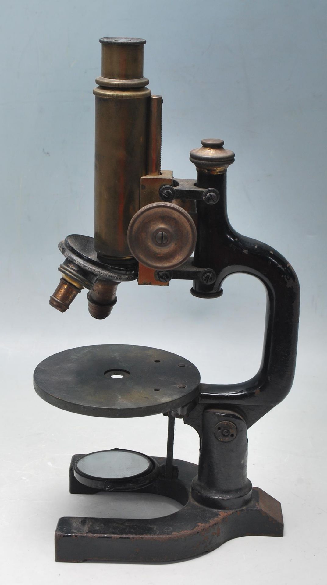 AN EARLY 20TH CENTURY EDWARDIAN VINTAGE BRASS AND EBONISED METAL AUSTRIAN MADE MICROSCOPE
