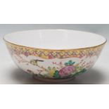 AN ANTIQUE 19TH CENTURY CHINESE FAMILLE ROSE BOWL