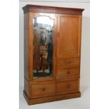 EDWARDIAN WALNUT WARDROBE WITH MIRROR DOOR RAISED ON A PLINTH BASE