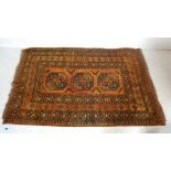 VINTAGE PERSIAN ISLAMIC RUG HAVING A ORANGE BACKGROUND WITH A TRIPLE LOZENGE MOTIF