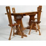 A VINTAGE 20TH CENTURY WELSH DINING TABLE AND FOUR CHAIRS