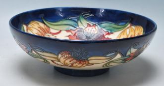 A LARGE MOORCROFT LILLY PATTERN BOWL