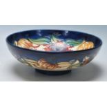 A LARGE MOORCROFT LILLY PATTERN BOWL