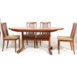 A RETRO 1960’S TEAK WOOD G-PLAN TABLE AND CHAIRS