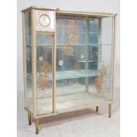 A MID 20TH CENTURY MARBLE EFFECT MELAMINE CHINA DISPLAY CABINET