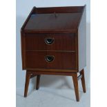 A MID CENTURY TEAK WOOD BUREAU WITH FALL FRONT AND FITTED INTERIOR