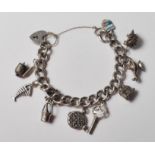 VINTAGE STERLING SILVER CHARM BRACELET