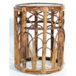 A 20TH CENTURY BAMBOO STOOL / PLANT STAND WITH ARCHED DECORATION