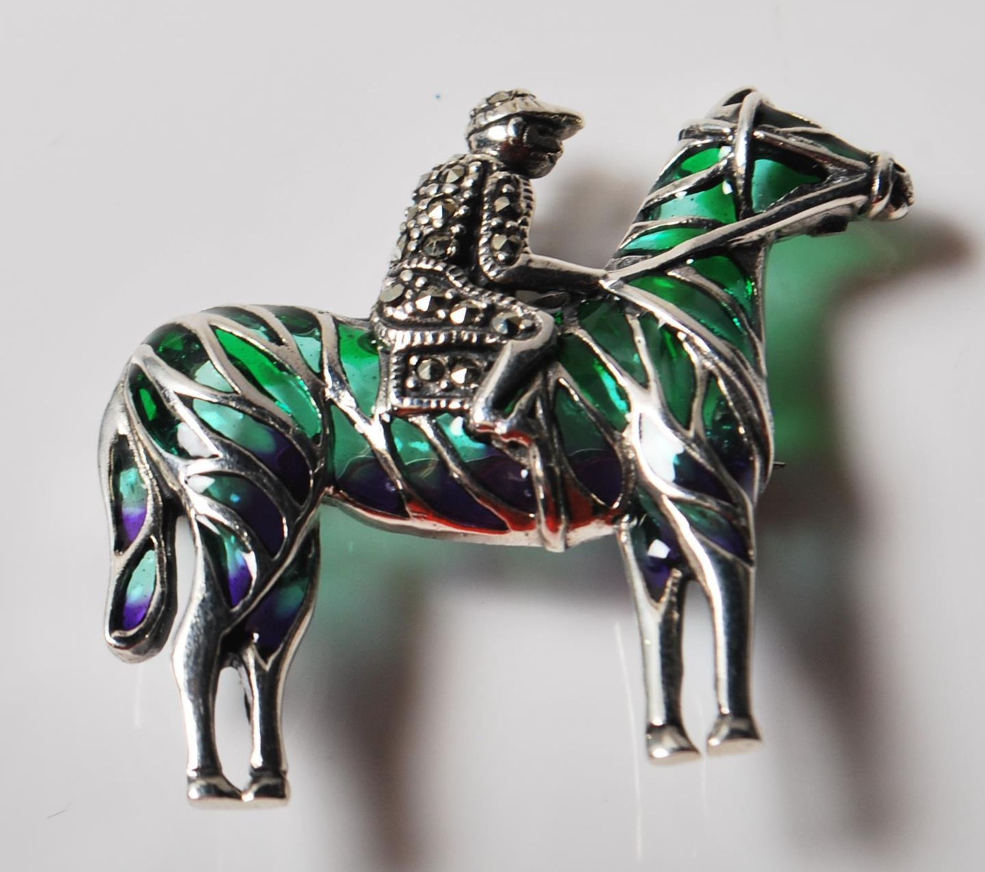 SILVER AND MARCASITE HORSE RACING BROOCH