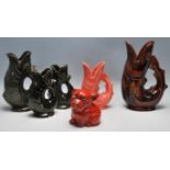 A COLLECTION OIF FIVE CERAMIC GUGGLE JUGS BY DARTMOUTH AND SHREVE