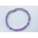 A HALLMARKED 925 SILVER & BRAZILIAN AMETHYST TENNIS BRACELET