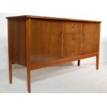 MID CENTURY WALNUT SIDEBOARD - BANK OF THREE DRAWERS TO THE CENTRE - BRASS HANDLES
