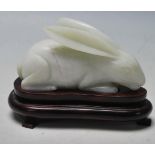 LATE 20TH CENTURY CHINESE REPUBLIC HANDCARVED JADE HARE ON STAND