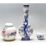 A 20TH CENTURY CHINESE ORIENTAL FAMILY VERTE LIDDED AND A BLUE AND WHITE VASE