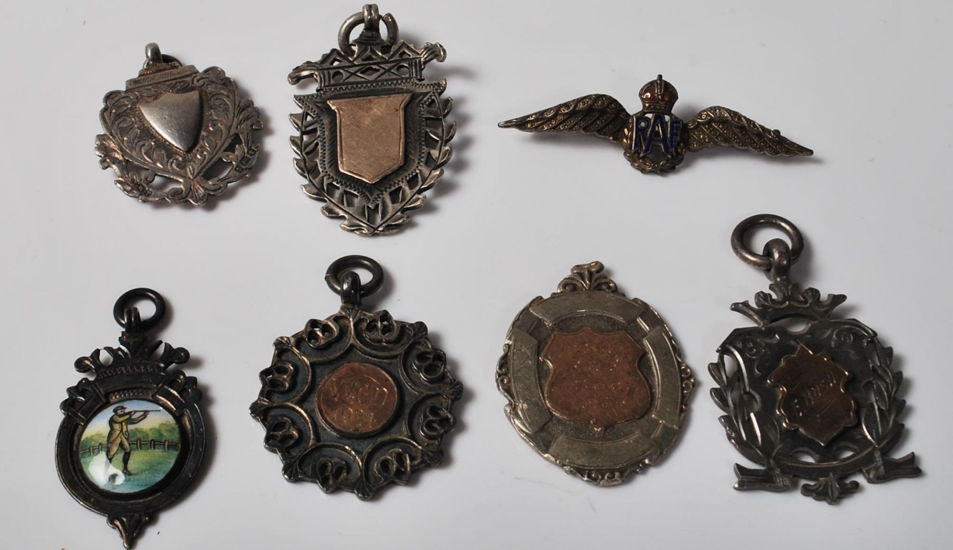 GROUP OF ANTIQUE SILVER FOB MEDALS AND RAF BADGE