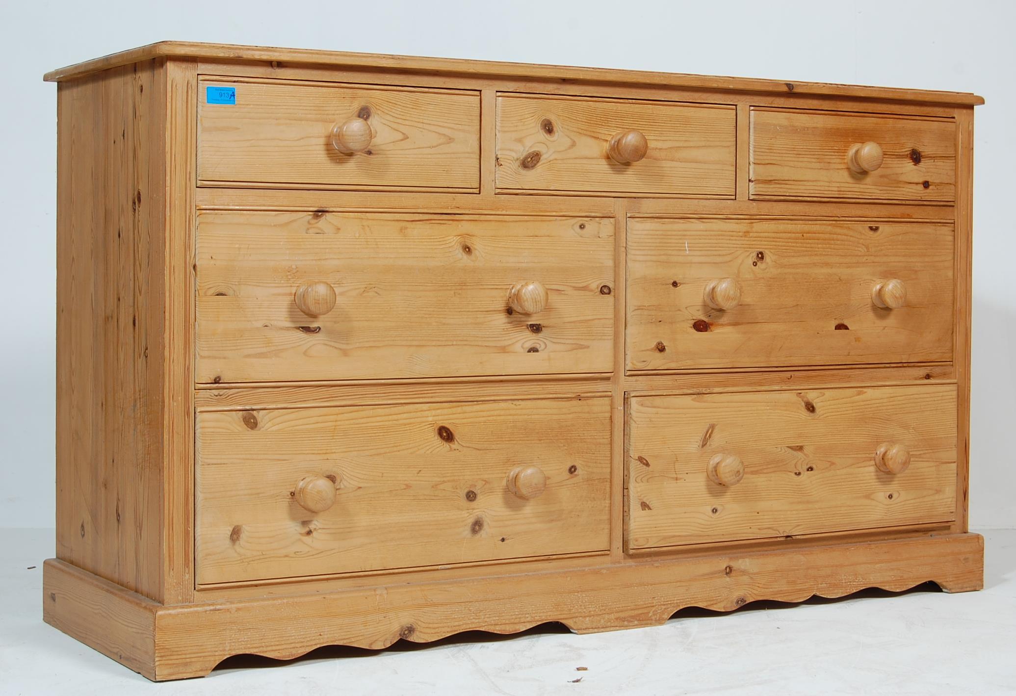 A LATE 20TH CENTURY PINE CUPBOARD / SIDEBOARD RAISED ON A PLINTH BASE