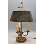 A LATE 19TH CENTURY FRENCH BRASS AND TOLEWARE DESK LAMP WITH ADJUSTABLE SHADE