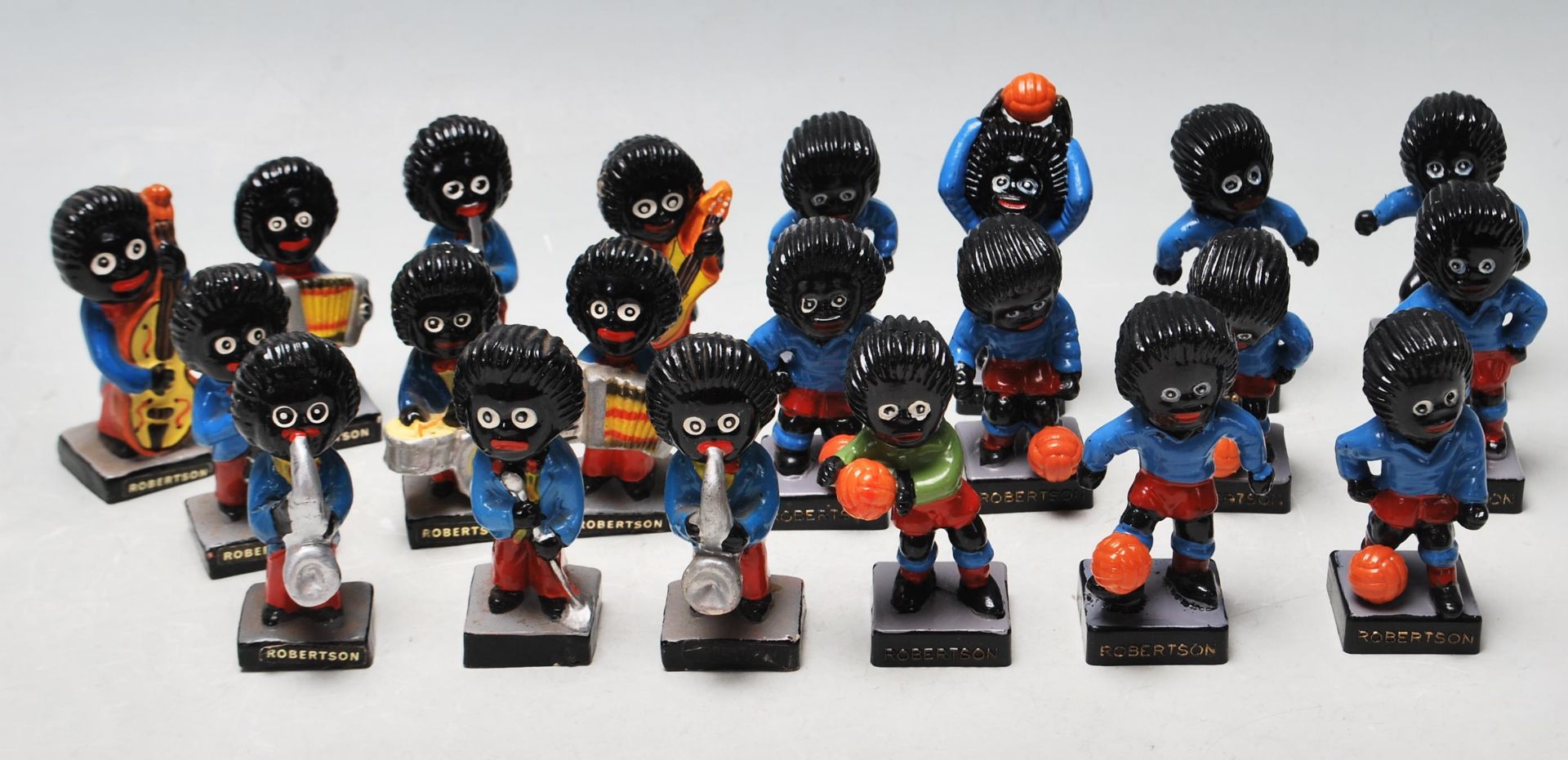 A COLLECTION OF 21 GOLLY FIGURINES BY ROBERTSON