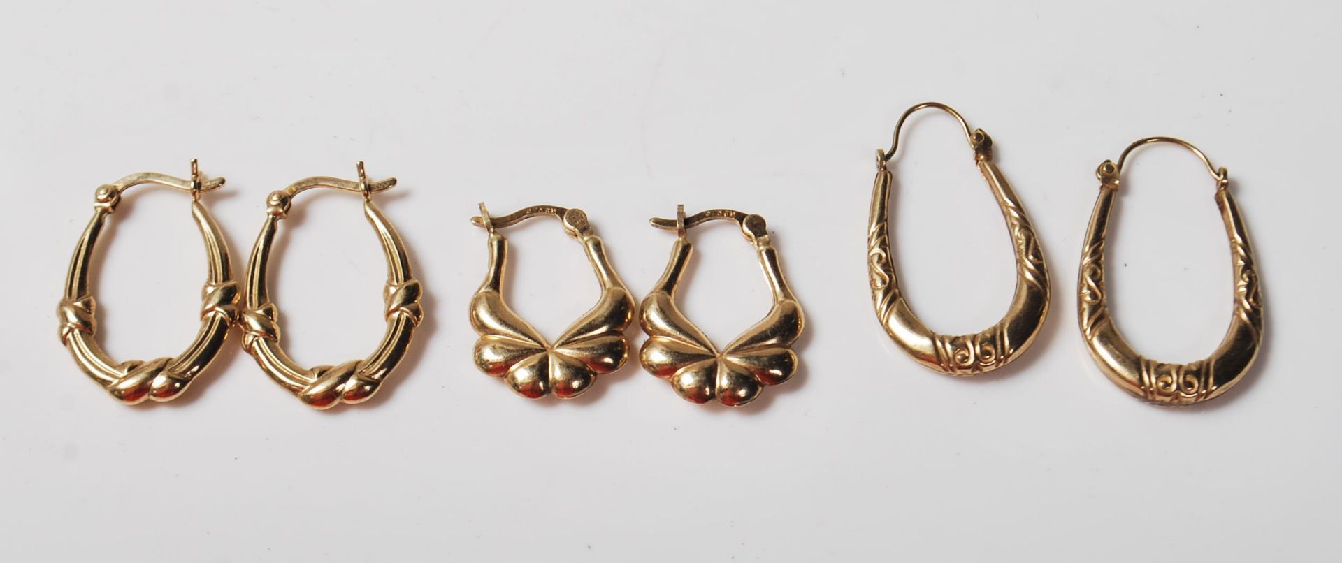 THREE PAIRS OF 9CT GOLD HOOP EARRINGS