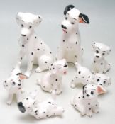 A COLLECTION OF EIGHT DISNEY PORCELAIN 101 DALMATIANS FIGURINES