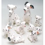 A COLLECTION OF EIGHT DISNEY PORCELAIN 101 DALMATIANS FIGURINES