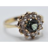 9CT GOLD GREEN AND WHITE STONE CLUSTER RING