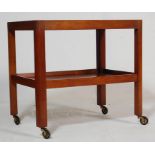 A RETRO MID 20TH CENTURY GORDON RUSSELL TEAK WOOD TROLLEY RAISED ON CASTERS