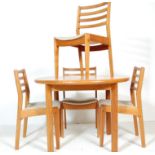 A VINTAGE 20TH CENTURY TEAK WOOD DINING TABLE AND CHAIRS