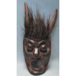 AN ANTIQUE AFRICAN TRIBAL CEREMONIAL DEVIL MASK / DEMON MASK OF WOODEN CONSTRUCTION