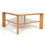 A VINTAGE 1970’S TEAK WOOD AND GLASS COFFEE TABLE BY NATHAN