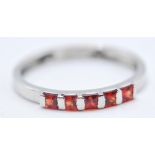 9CT WHITE GOLD AND RED STONE RING