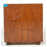 A MID CENTURY WALNUT RECORDS BOX WITH HINGED LID AND FITTED INTERIOR