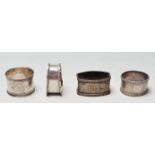 FOUR ANTIQUE SILVER NAPKIN RINGS