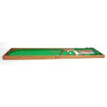 A 19TH CENTURY VICTORIAN TABLE TOP BAGATELLE CASE GAME