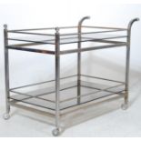 1970’S RETRO SMOKED GLASS AND CHROME METAL TWP TIER TROLLEY / BUTLERS TROLLEY