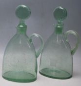 TWO 18TH CENTURY GREEN GLASS GEORGIAN DECANTERS WITH SPIRAL HANDLES