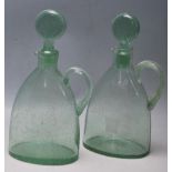 TWO 18TH CENTURY GREEN GLASS GEORGIAN DECANTERS WITH SPIRAL HANDLES