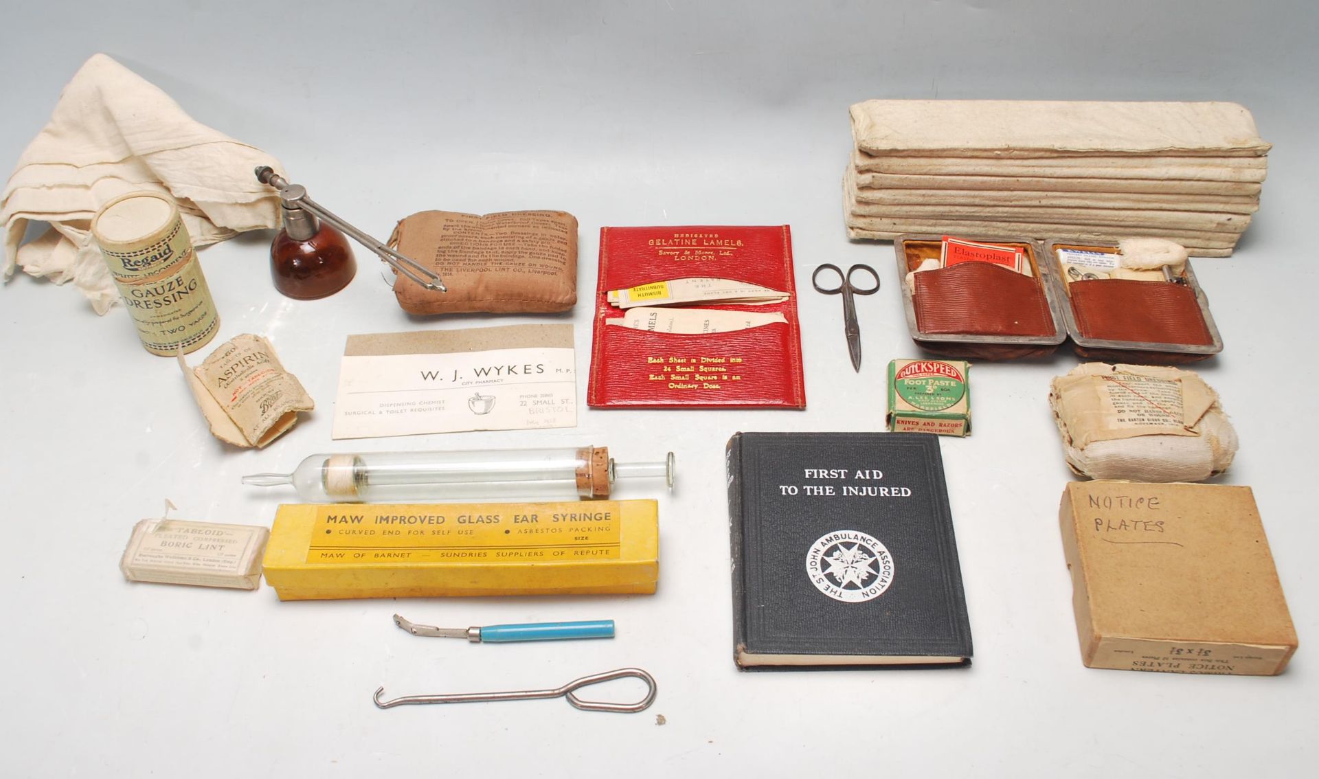 COLLECTION OF VINTAGE MILITARY AND CIVILIAN EARLY 20TH CENTURY FIRST AID ITEMS