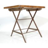 AN INDUSTRIAL RETRO TRESTLE TABLE CONSTRUCTED FROM RECLAINED PINE WOOD BOARDS AND METAL.