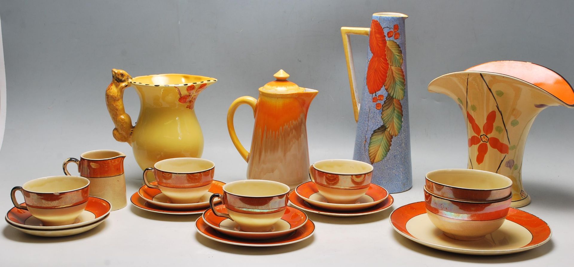 A QUANTITY OF VINTAGE 20TH CENTURY CERAMIC WARE FINISHED IN ORANGE COLOUR